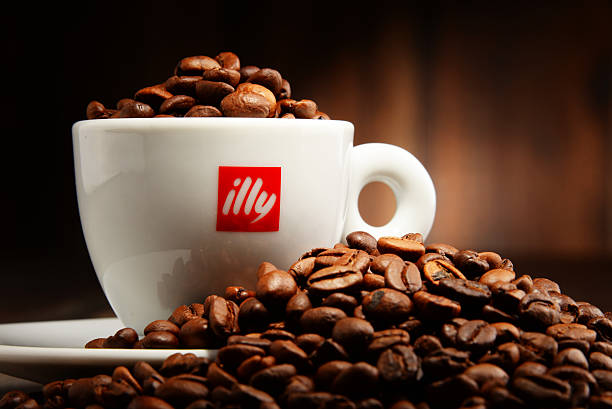 illy espresso cup filled with roasted coffee beans